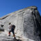 Stephanie Aikin hiking up a rock.