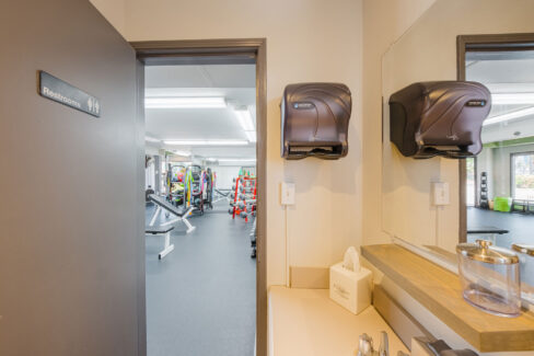 Move Your Mountain the bathroom then looking out the door to the gym.