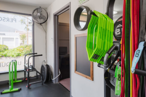 Move Your Mountain with rubber ropes hanging on the wall.