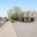 Move Your Mountain exterior shot with cars driving along the street.